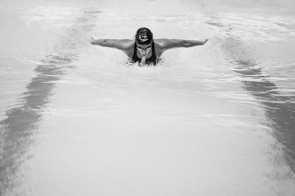 Manna Patel is swimming in the swimming pool